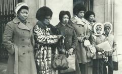 Five-Jamaican-women-and-two-young-girls-standing-outside