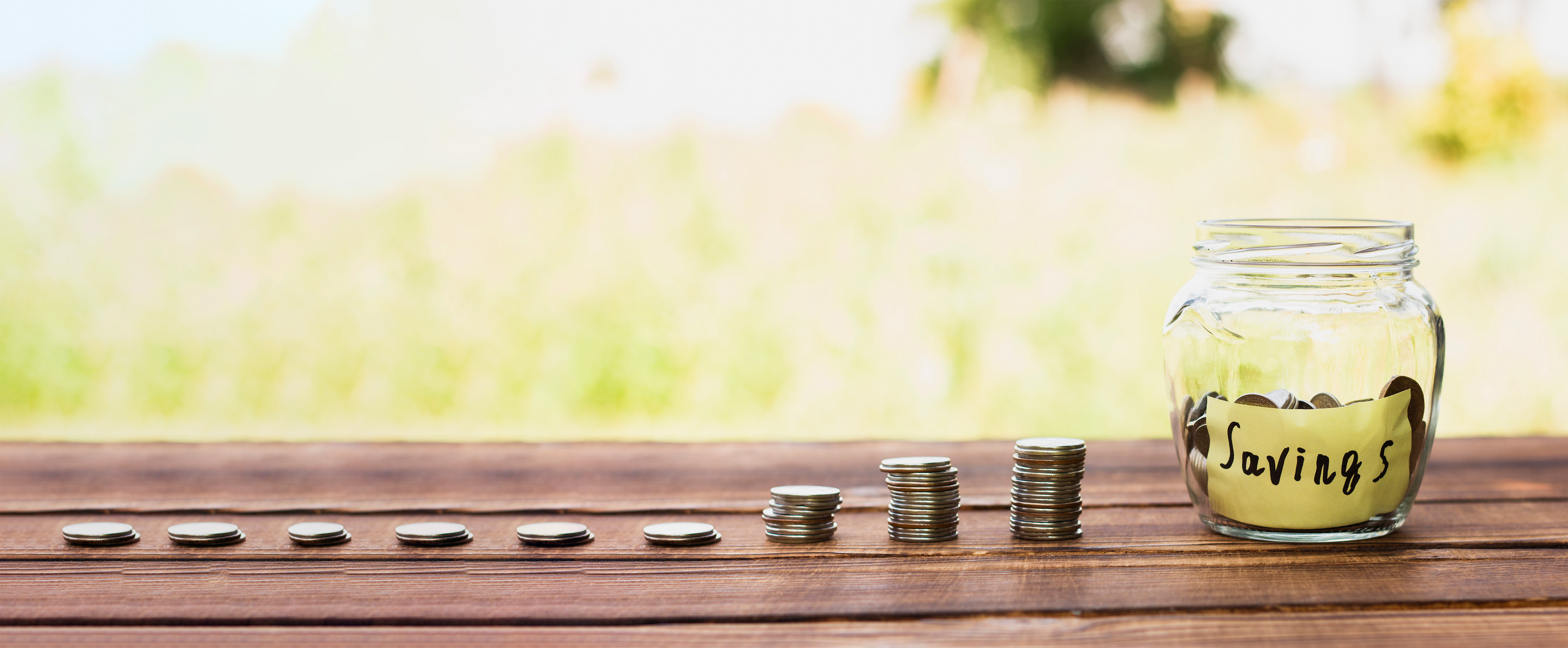 jar-with-savings-coins-stack-table-smaller