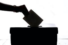 Hand-Putting-Voting-Ballot-in-Ballot-Box-Silhouette